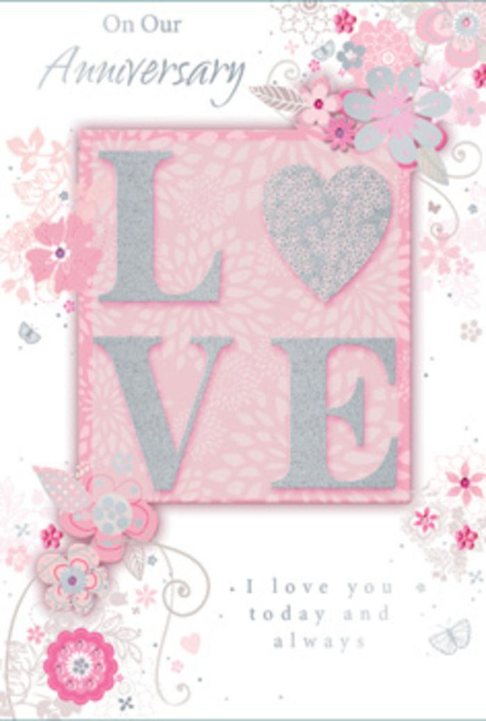 This beautifully crafted anniversary card exudes the kind of understated romance that suits an intimate celebration at home in Rush Green. Dominating the design is the word LOVE, set in large, confident capital letters that are raised above the card's surface. Each letter is edged with fine glitter that glistens gently rather than flashing boldly, offering both a visual highlight and a subtle texture under the fingertips. The word is placed against a blush-pink panel, slightly darker than the main background, which creates a sense of depth and acts like a soft spotlight. Flowing out from this centrepiece is a delicate array of stylised flowers, leaves, and swirling vines that sweep across the card. These floral motifs are intricately drawn with slim outlines and shaded in a harmonious range of blush pinks, pearlescent whites, and silvery-grey accents, reminiscent of the pastel bouquets often prepared for anniversary deliveries in Rush Green and nearby Chadwell Heath. Some petals are filled with gentle colour, while others are touched with tiny hints of glitter or silver foil, catching ambient light like morning sun on dewy petals. The background is a light, powder-pink tone that keeps the composition bright and airy, framing the florals without overwhelming them. Fine curl patterns and ornamental scrolls entwine through the blooms, creating movement and a sense of quiet celebration, as if the flowers are slowly unfurling on a windowsill. An elegant, flowing script conveys the anniversary message, expressing ongoing love and appreciation in soft, romantic language. The entire card feels like a carefully arranged paper bouquet: tactile, pastel, and deeply sentimental, perfect to accompany fresh flowers delivered locally for an anniversary in this friendly East London community.